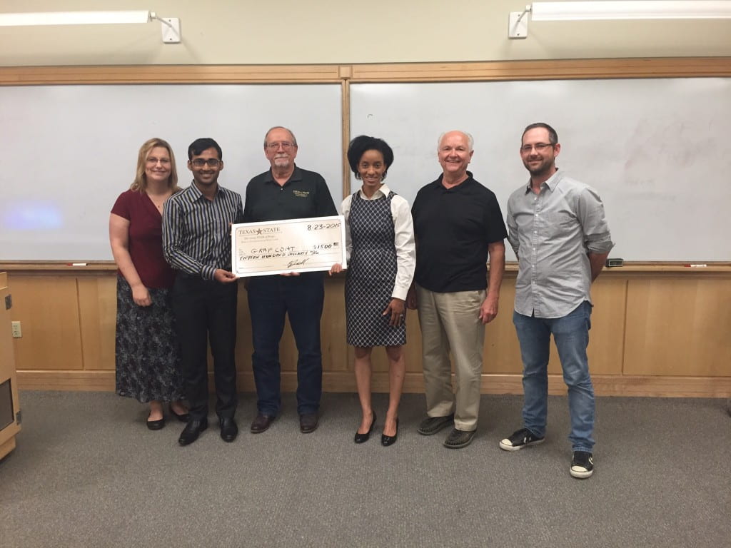 Carol Ellis-Terrell (MSEC Ph.D. student) (center right) along with fellow students Rony Saha (MSEC) and Thomas Turner (MFA) receives 1st place award for best business presentation at MSEC Boot Camp (Aug 2015).