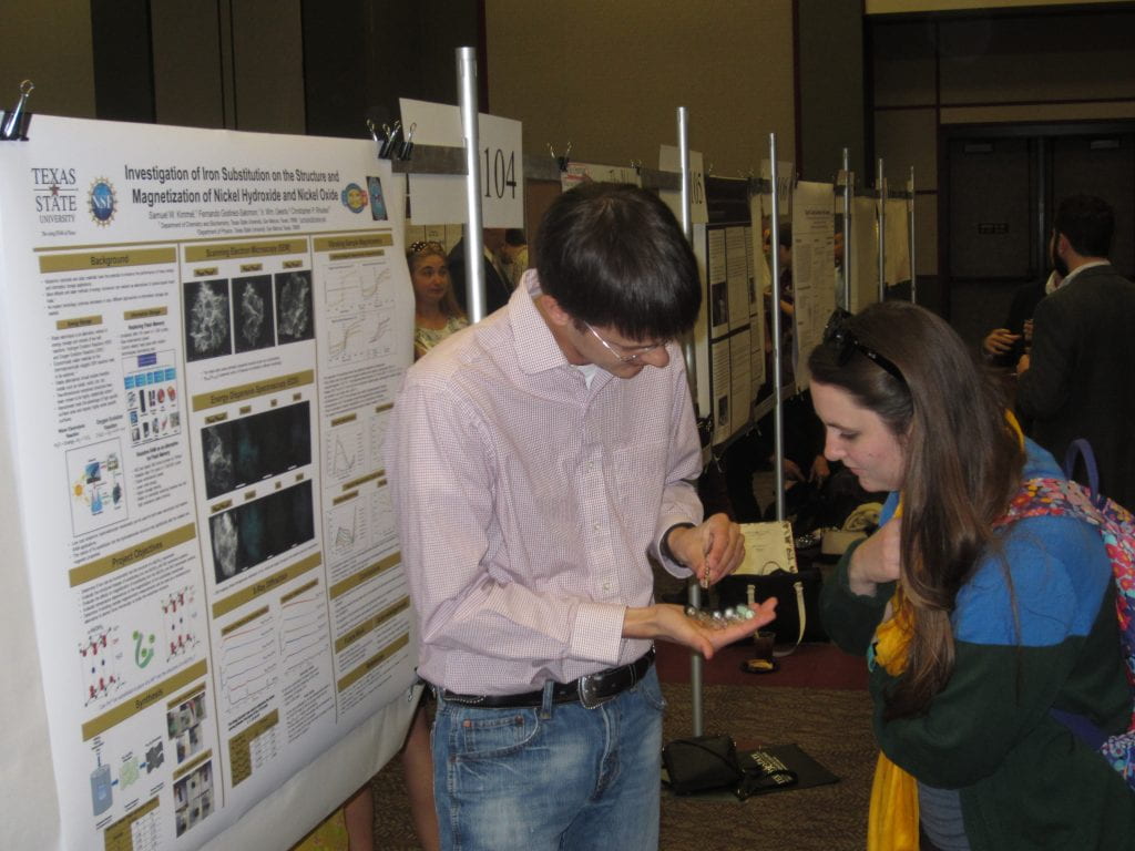 Sam Kimmel presenting his poster entitled “Investigating the Effects of Iron Substitution on the Structure and Magnetization of α-Nickel Hydroxide and Nickel Oxide Nanosheets” at the Texas State University 12th Annual Undergraduate Research Conference, San Marcos, TX, April 20, 2018. Poster co-authors: F. Godínez-Salomón, F.; I.W. Geerts, and C.P. Rhodes.