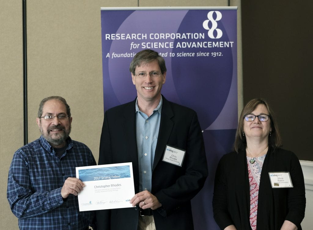 Dr. Chris Rhodes receiving award 2017 Scialog Fellow Award for “Advanced Energy Storage” from Research Corporation (pictured left to right: Dr. Richard Weiner, Dr. Chris Rhodes, Silvia Ronco).